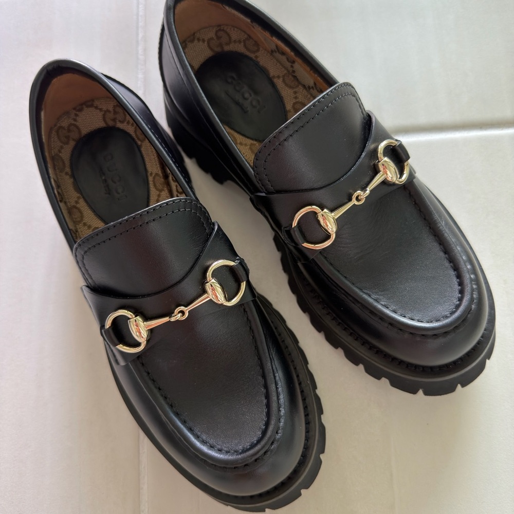 Gucci Black Leather Loafers with Gold Accents